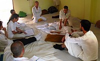 Zen Shiatsu class in the dojo, abdominal treatment with rocking technique.